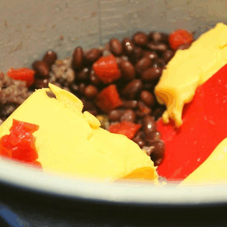 Black beans, Ro-Tel, Velveeta, and seasonings mixed in Ninja Foodi before pressure cooking