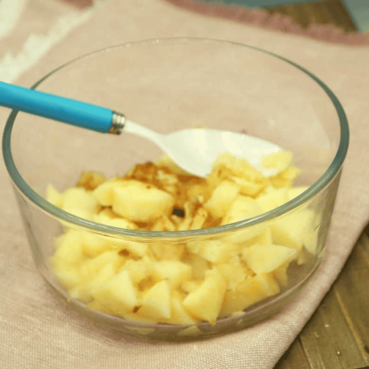 Diced apples, butter, brown sugar and cinnamon cooking in a small skillet