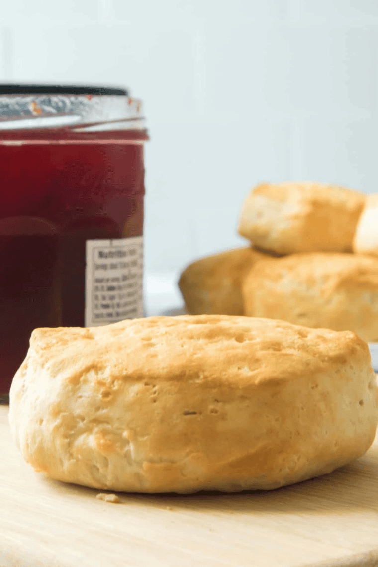 Golden brown canned biscuits cooked in an air fryer, showing fluffy layers and crisp tops.