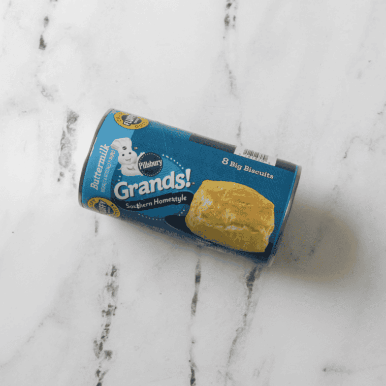 Ingredients needed for Air Fryer Canned Biscuits on kitchen table.