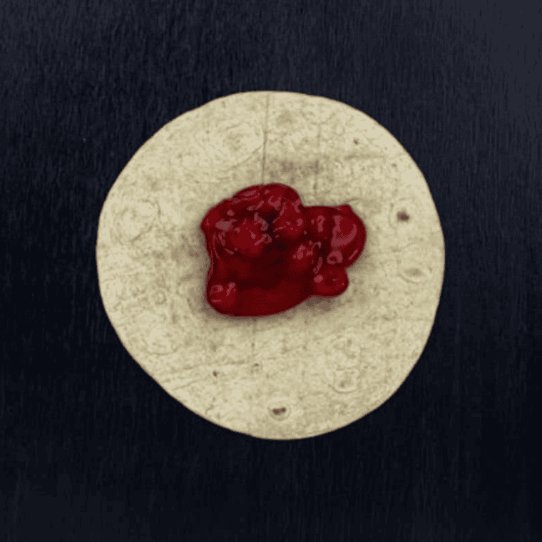 Cherry pie filling spooned into the center of a flour tortilla for air fryer chimichangas