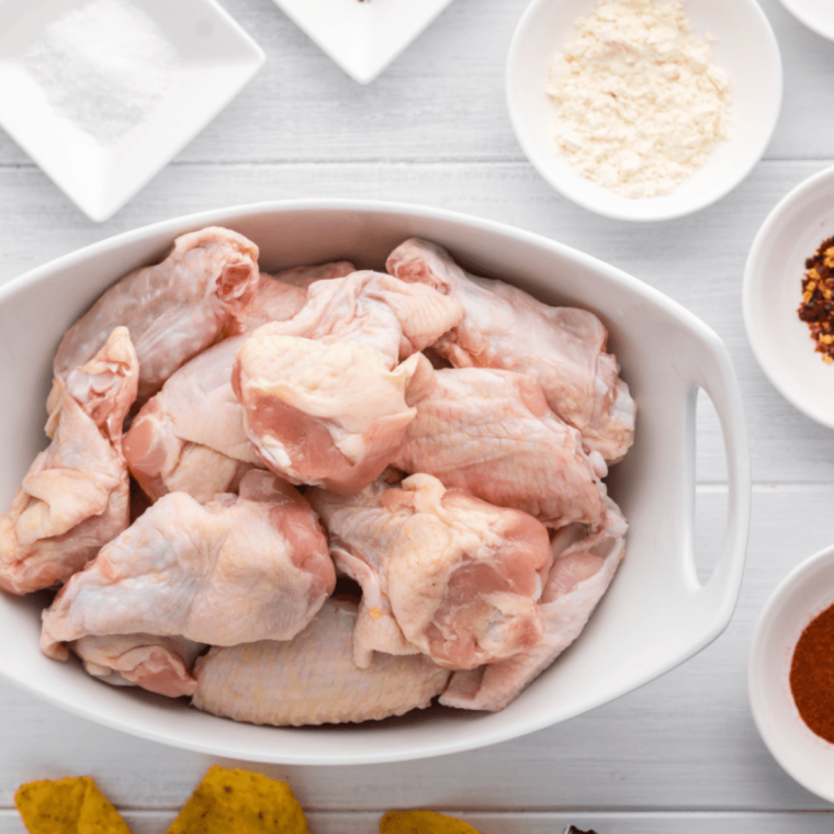 Ingredients needed for Air Fryer Honey BBQ Chicken Wings on kitchen table.