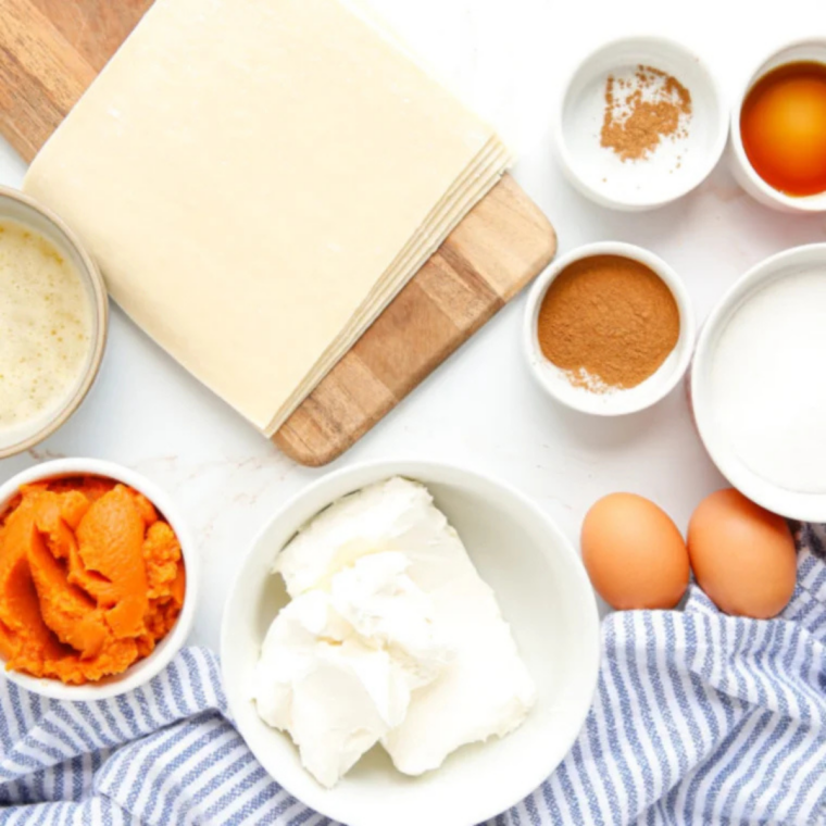 Butter, pumpkin puree, flour, sugar, and fall spices measured out for pumpkin coffee cake