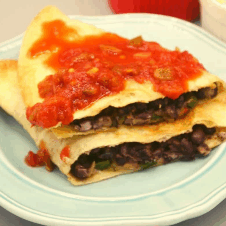 Golden air fryer black bean quesadillas filled with beans and melted cheese