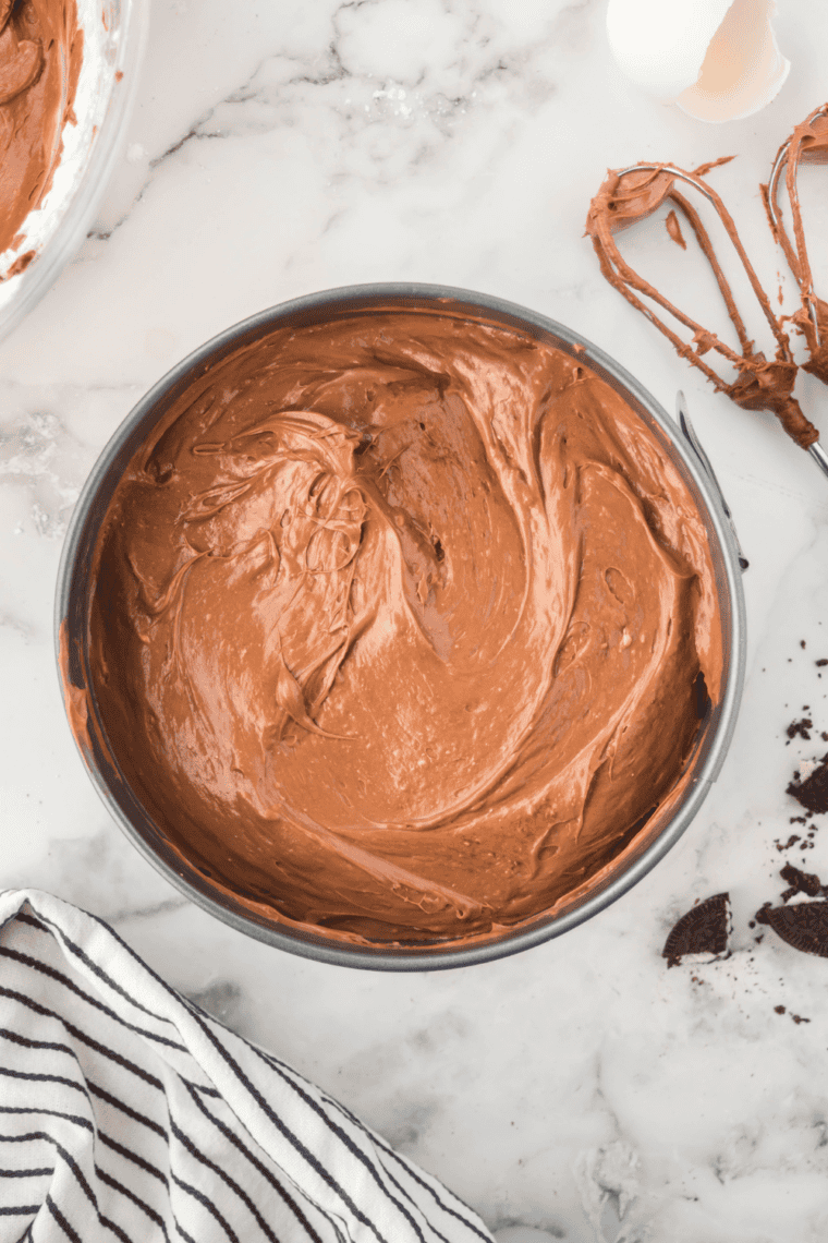 Pouring cheesecake batter over cookie crust and cooking in the air fryer.