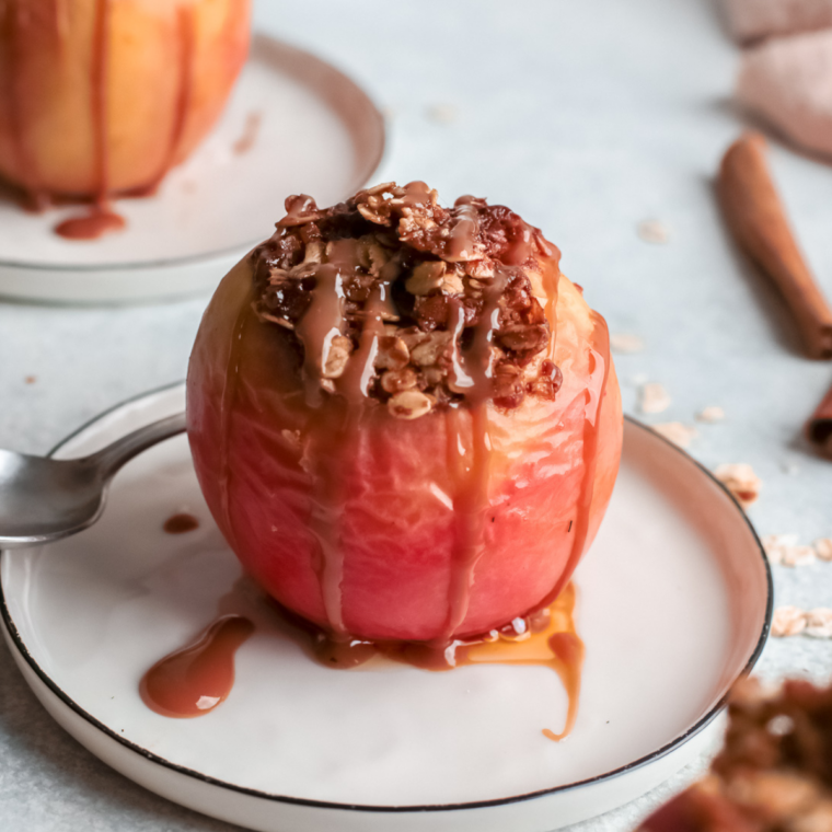 Air fryer baked apples stuffed with cinnamon sugar filling, tender and caramelized, served warm in a bowl as an easy 20-minute dessert.
