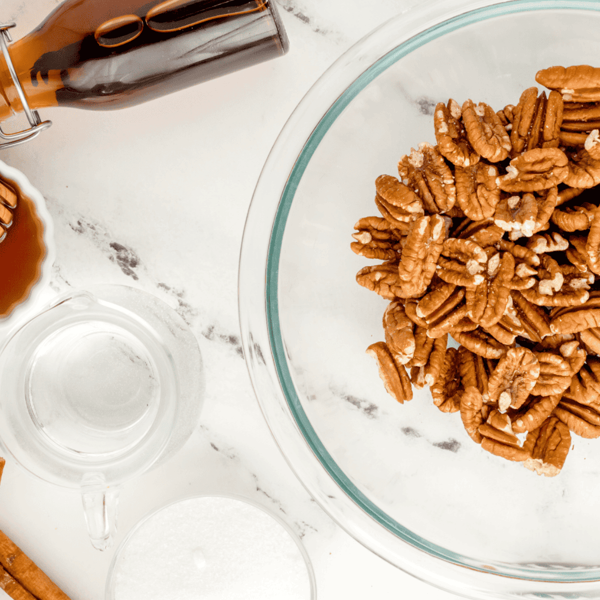 Ingredients needed for Air Fryer Candied Pecans on kitchen table.