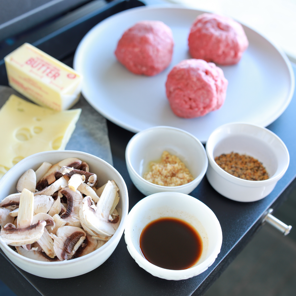Ingredients for Blackstone smash burgers including 80/20 ground chuck, American cheese, potato buns, salt and pepper.