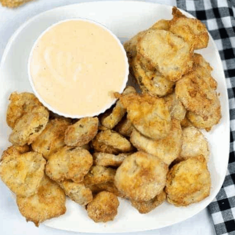Crispy air fryer Cajun fried pickles served hot with dipping sauce