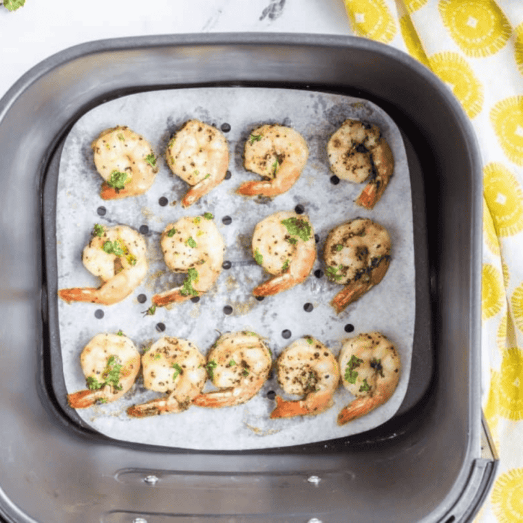Cooked Easy Copycat P.F. Chang's Lemon Pepper Shrimp Recipe in the air fryer basket.