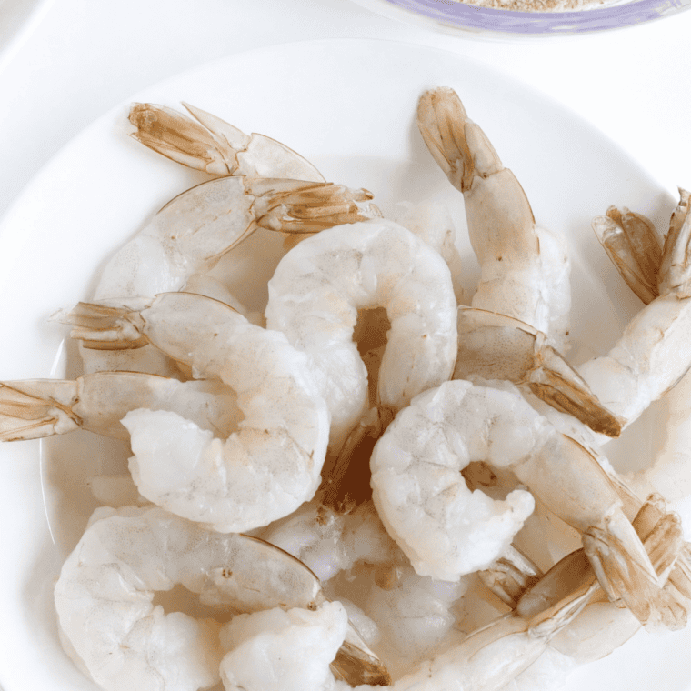 Ingredients needed for Easy Legal Sea Foods Bacon-Wrapped BBQ Shrimp on kitchen table.