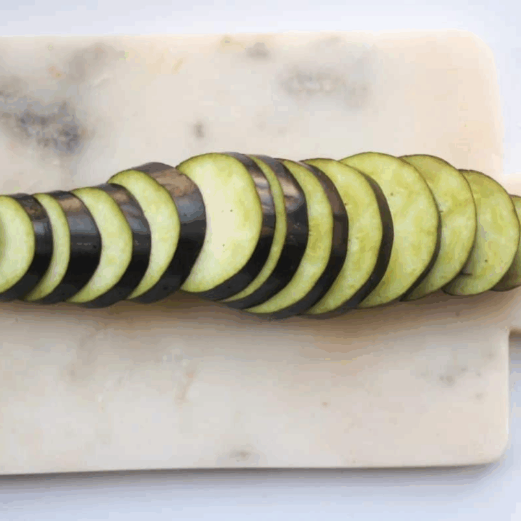 Sliced eggplant rounds cut evenly for air fryer cooking