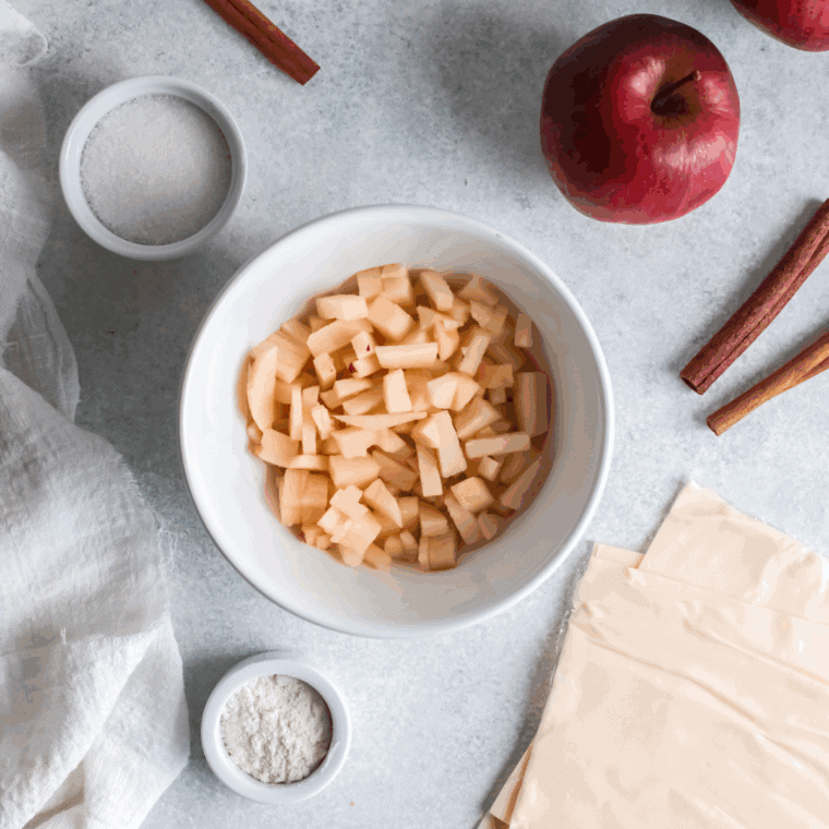 Ingredients needed for Air Fryer Apple Turnovers on kitchen table.