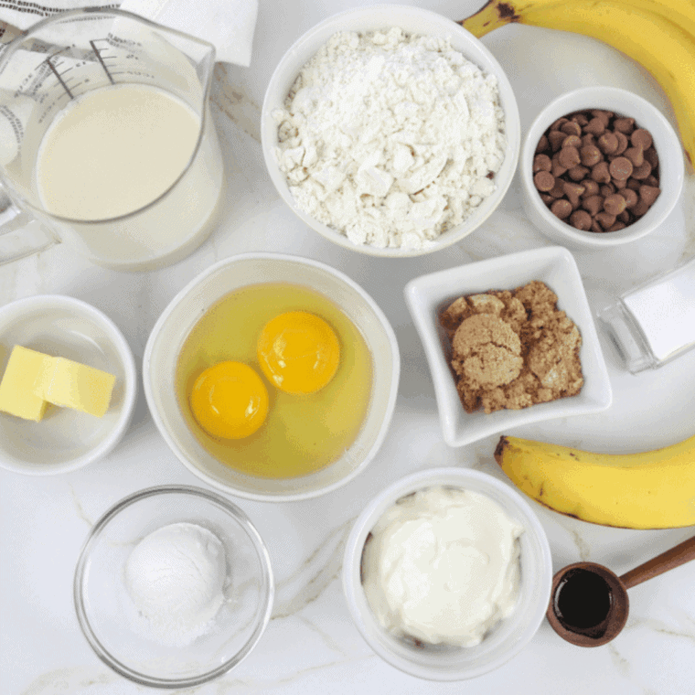 Ingredients needed for Air Fryer Banana Walnut Pound Cake on kitchen table.
