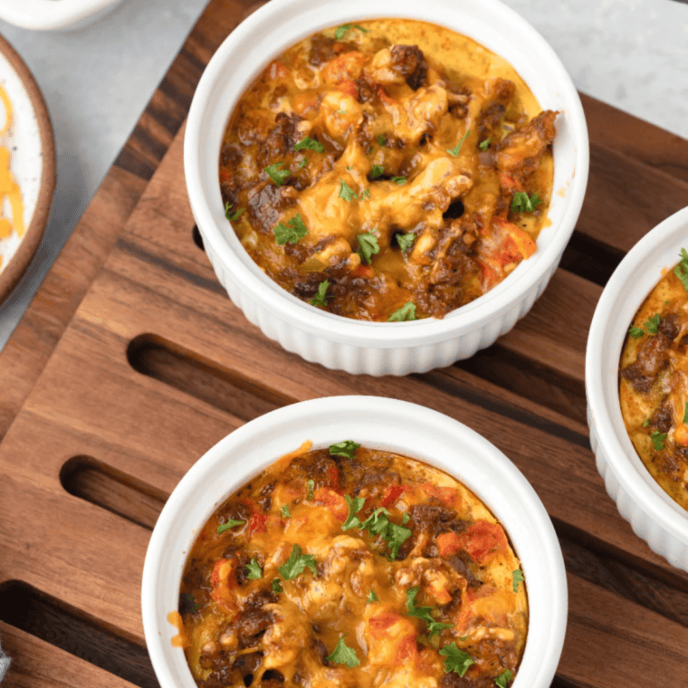 Finished air fryer breakfast casserole with melted cheddar, ready to serve