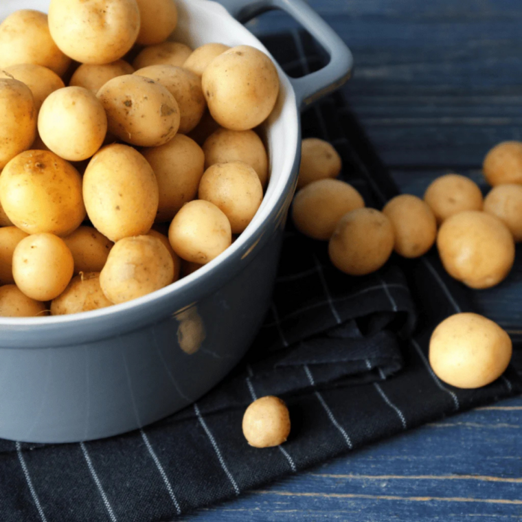 Ingredients for air fryer fingerling potatoes: whole fingerlings, olive oil, kosher salt, and black pepper
