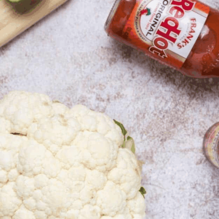 Ingredients needed for Copycat Buffalo Wild Wings Buffalo Cauliflower Bites on kitchen table.