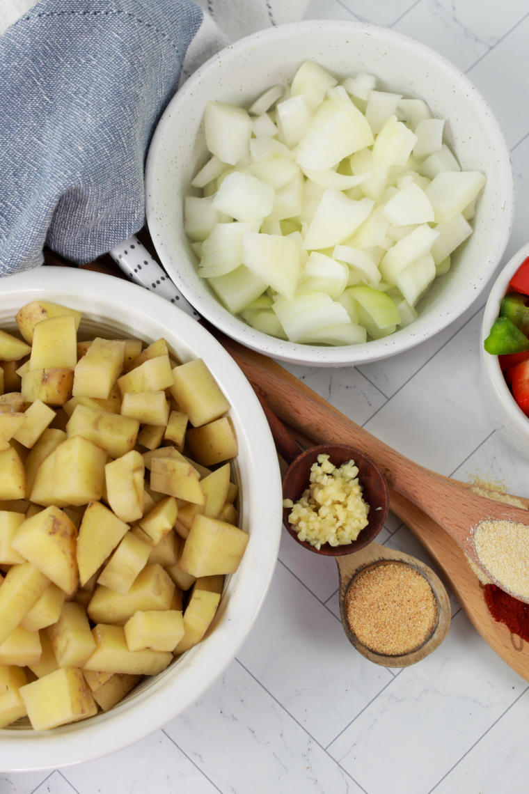 Ingredients needed for Crispy Air Fryer Breakfast Potatoes (Diner-Style in 20 Minutes) on kitchen table.
