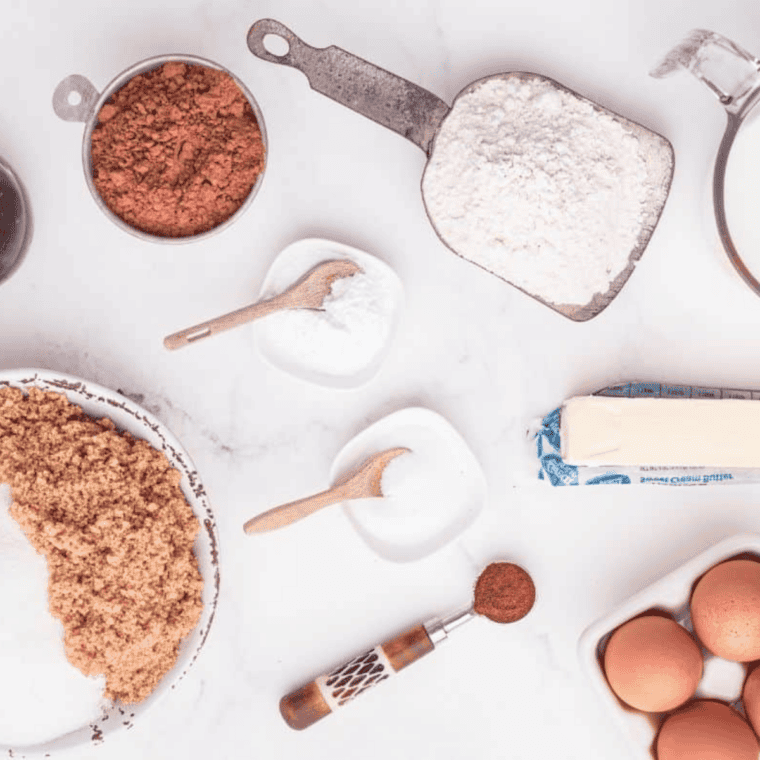Ingredients needed for Easy Air Fryer Chocolate Cupcakes on kitchen table.