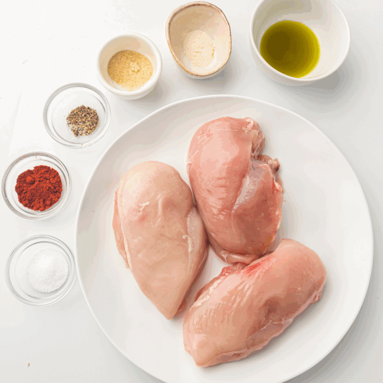 Ingredients needed for Easy Air Fryer Lemon Garlic Chicken Breast on kitchen table.