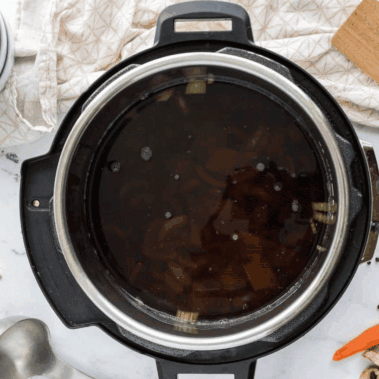 Pour broth into the Instant Pot Bowl.