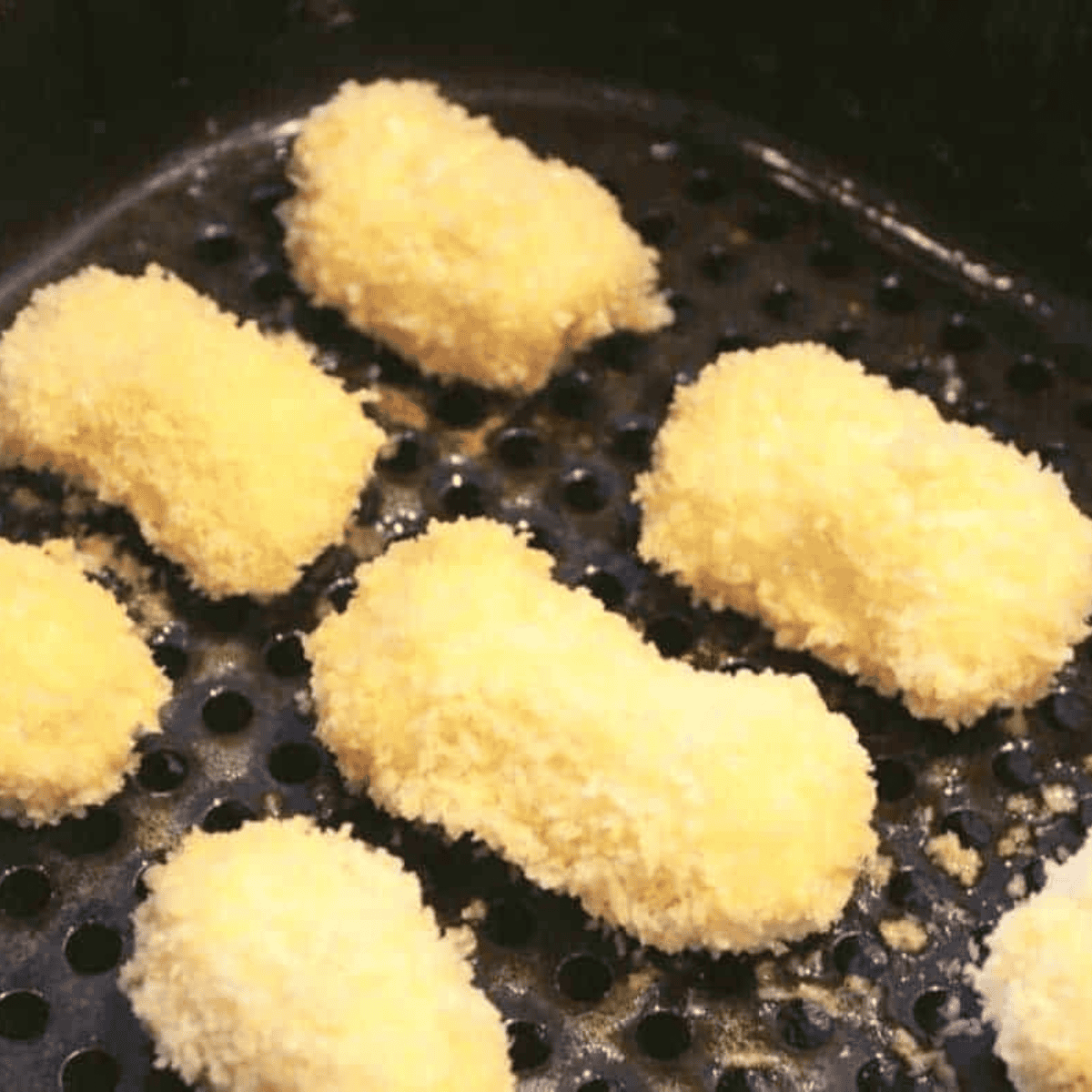 Place Mozzarella Bites in the air fryer basket.