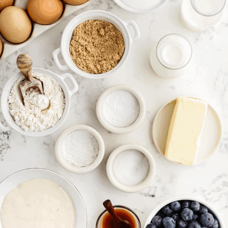 Ingredients needed for Air Fryer Berry Cream Muffins on kitchen table.