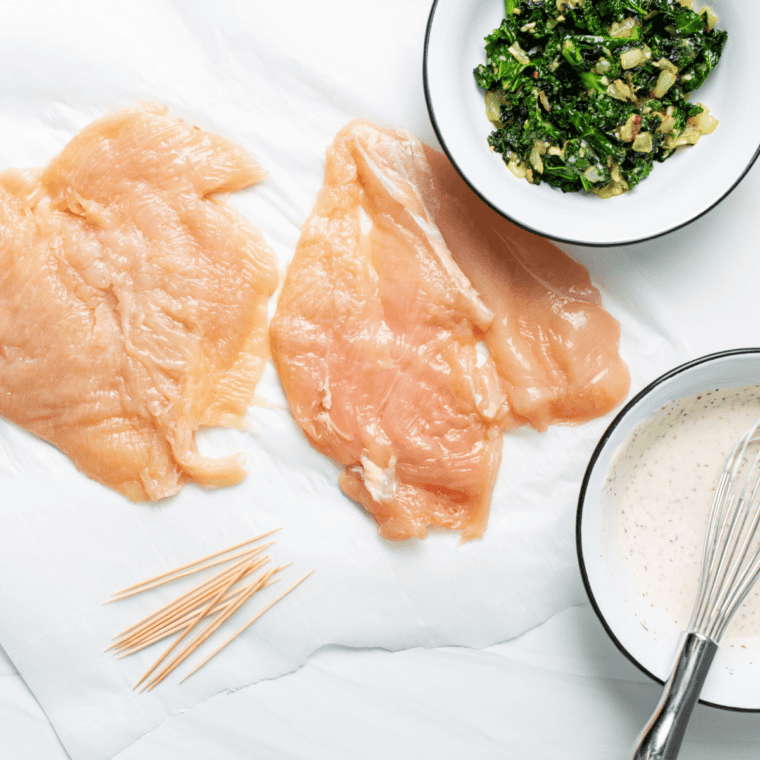 Three-dish breading station set up with flour, beaten eggs, and seasoned panko breadcrumb mixture ready for coating chicken.