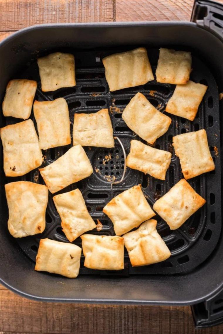 Hot air fried pastry bites tossed immediately in cinnamon sugar mixture to coat evenly while warm