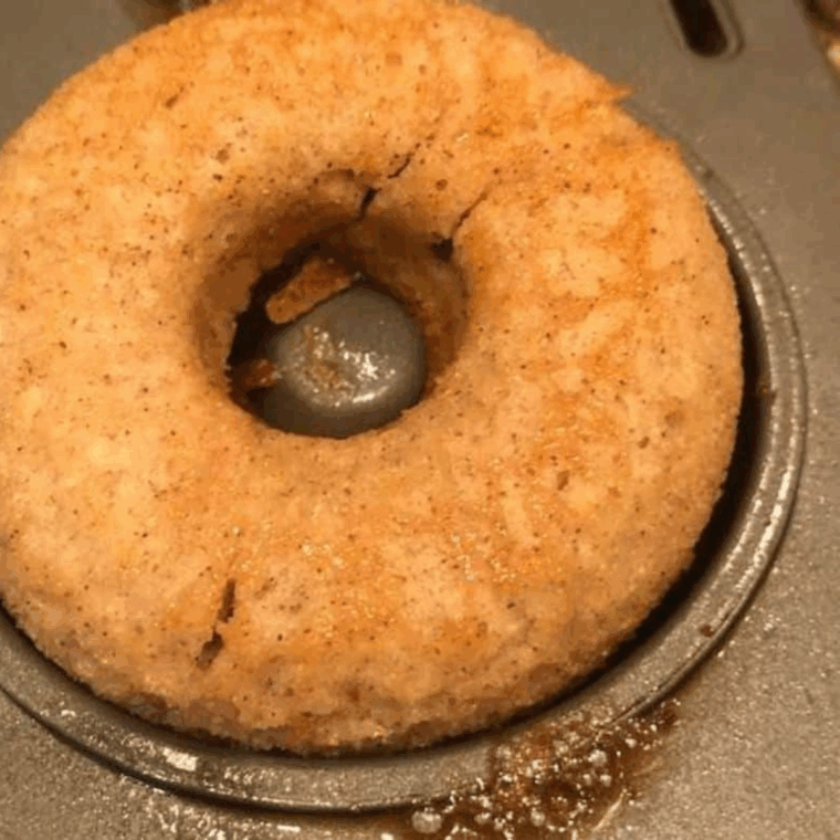 Placing banana donut pan in the air fryer, set to 320°F for 10–12 minutes.
