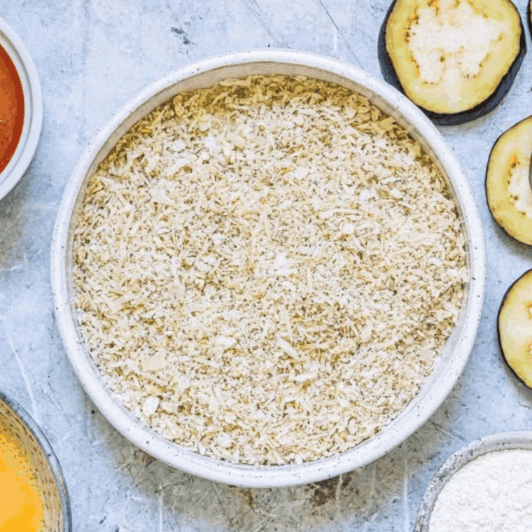 Ingredients needed for Easy Cheesecake Factory Eggplant Parmesan Recipe on kitchen table.