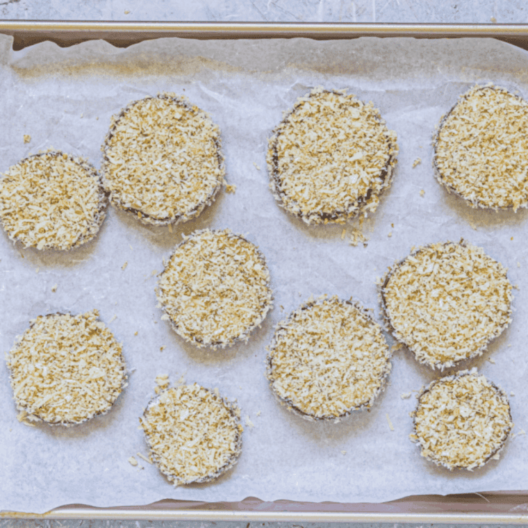 Eggplant slices dipped in beaten egg and coated with Parmesan breadcrumb mixture before cooking.