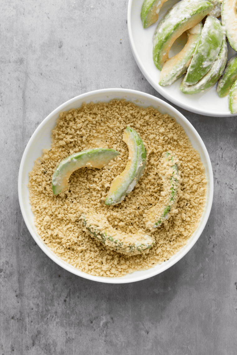 gluten-free breadcrumbs, Parmesan, salt, pepper, and seasonings mixed in bowl