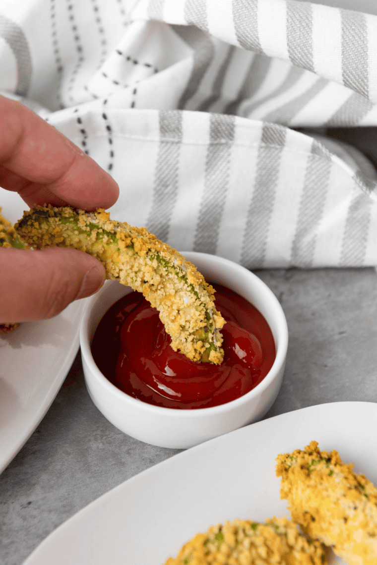 crispy gluten-free air fryer avocado fries served on plate with dipping sauce