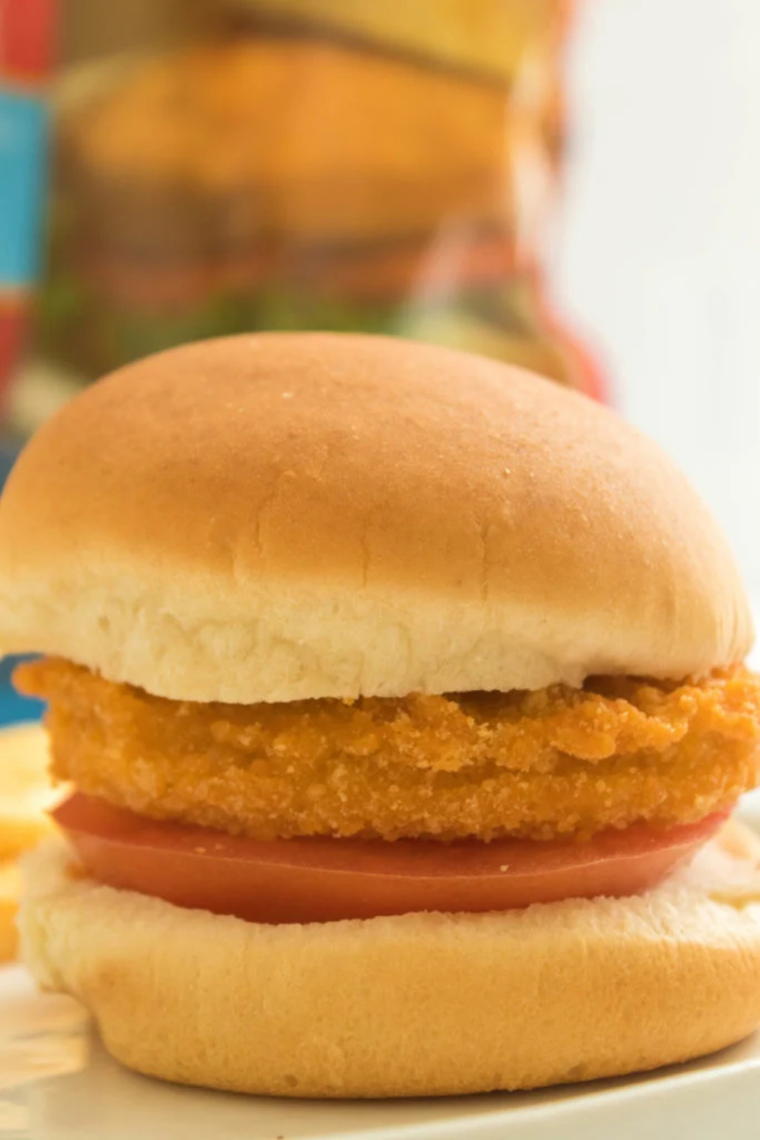 assembled crispy chicken patty sandwich with toppings ready to serve