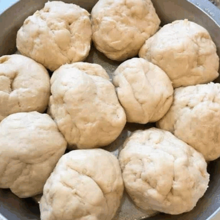 dough rolled into 1-2 inch balls placed in greased pan
