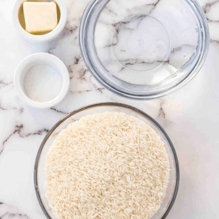 Ingredients needed for Greek Rice Instant Pot Recipe on kitchen table.