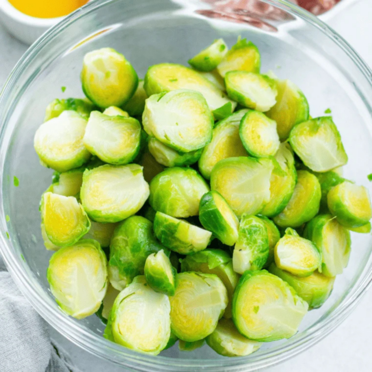 Cuisinart air fryer preheating to 400 degrees with a bag of frozen Brussels sprouts beside it