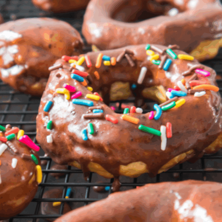 “Golden Air Fryer Nutella Donuts dusted with powdered sugar and filled with creamy Nutella.”