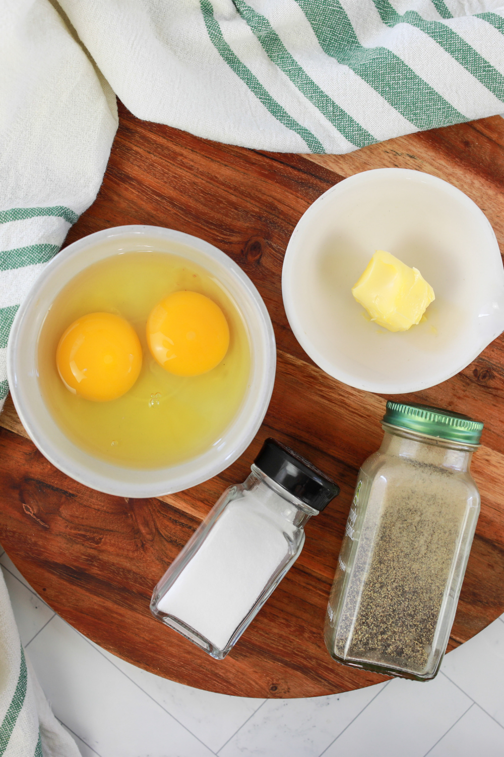 Ingredients needed for Air Fryer Scrambled Eggs (Soft, Fluffy, and Foolproof in 7 Minutes) on kitchen table.