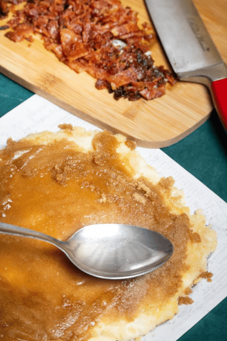 Dough spread evenly on pre-cut parchment paper in air fryer basket.