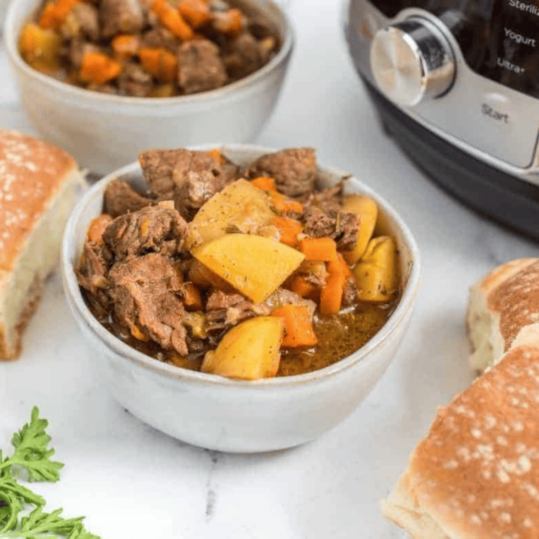 Finished copycat Panera Bread beef stew in the Instant Pot garnished with fresh parsley
