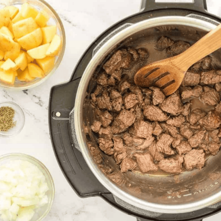 Searing beef stew meat in the Instant Pot for copycat Panera Bread beef stew