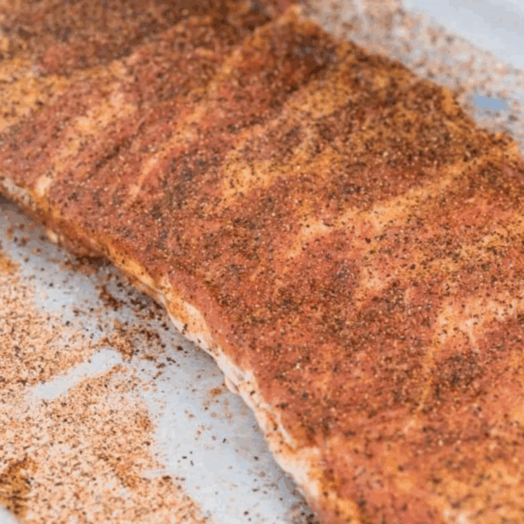 Apply the rub to the ribs.