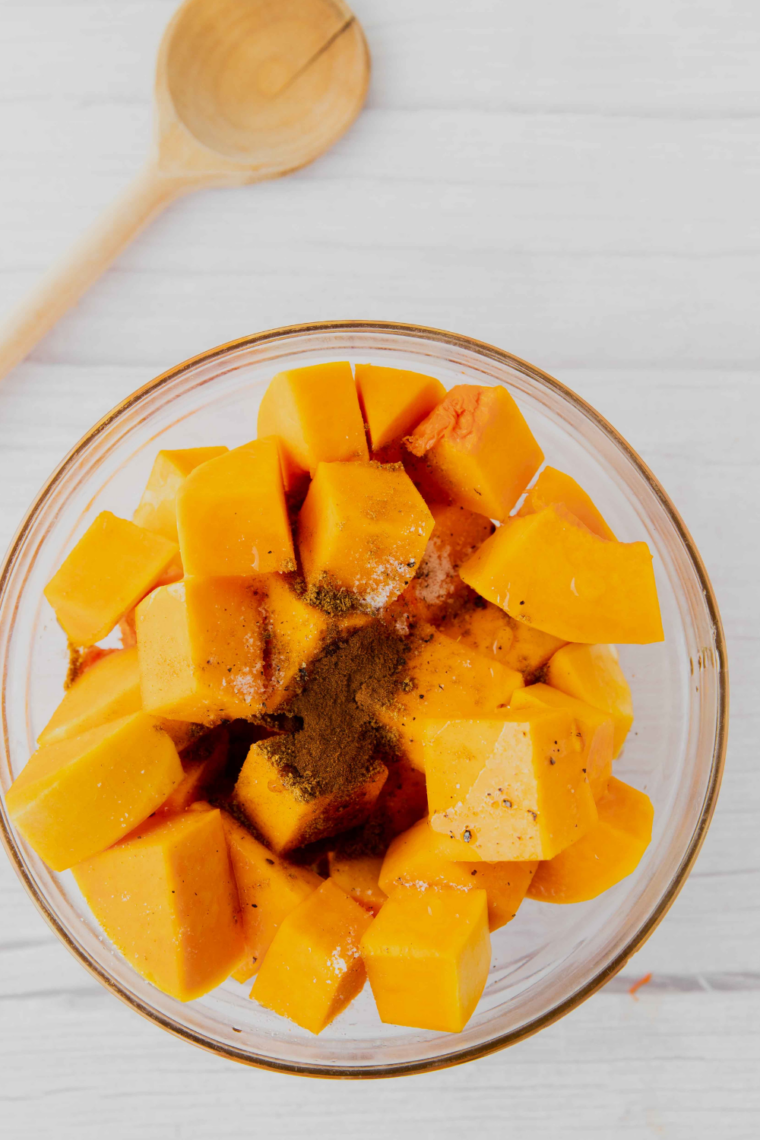 butternut squash cubes in single layer in air fryer basket for even crisping