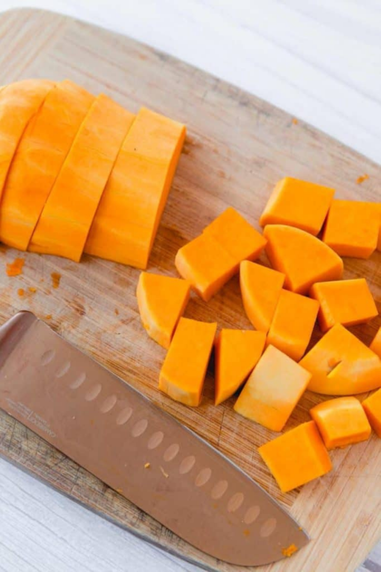 prepping butternut squash trimming peeling and cubing for even air fryer cooking