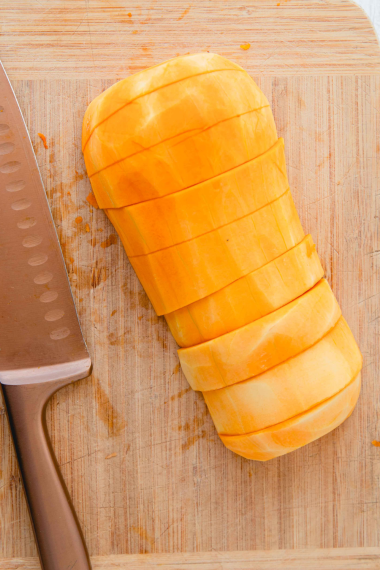 cutting butternut squash into uniform one inch cubes after peeling and seeding