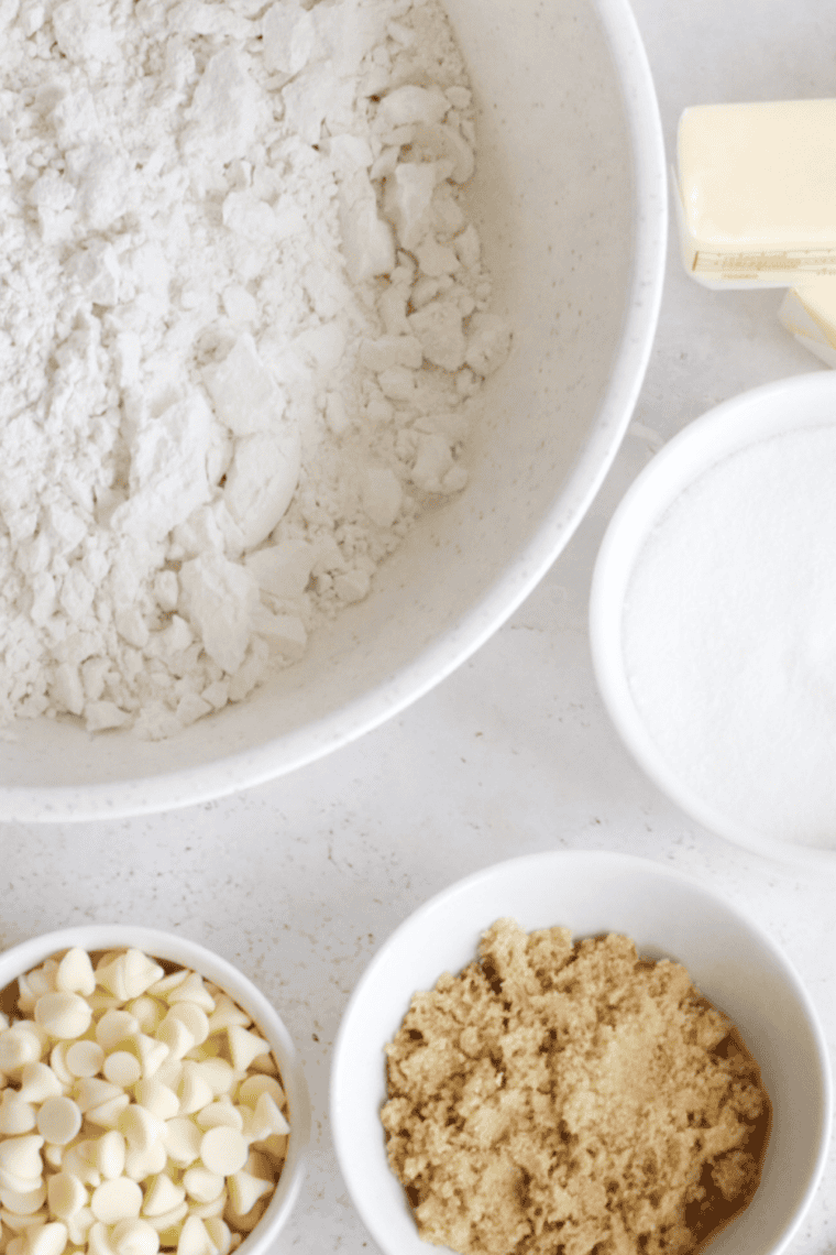 Whisking flour, baking soda, and salt together in a bowl.