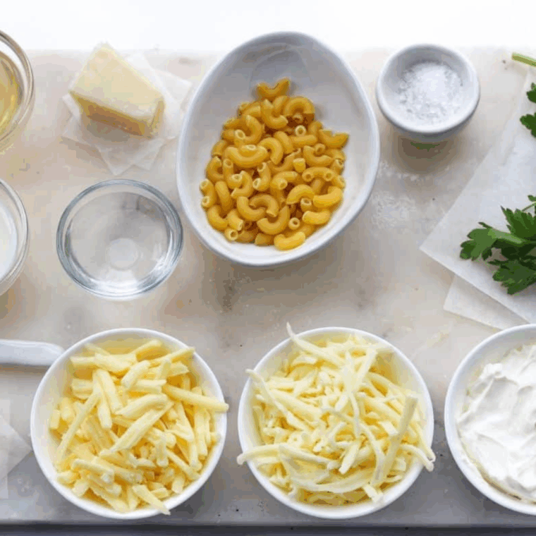 Ingredients needed for Chili’s White Cheddar Mac and Cheese Copycat Recipe on kitchen table.