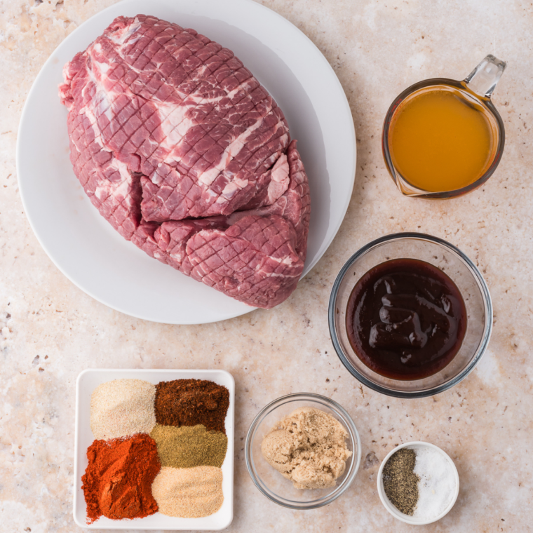 Ingredients for copycat Mission BBQ pulled pork including pork shoulder, spices, broth, and apple cider vinegar